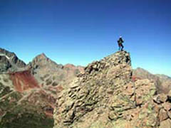 Photo of Jennifer on Lizard Head's summit, one of Colorado's toughest