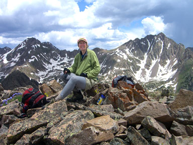 Jennifer on the summit flanked by West and East Partner peaks