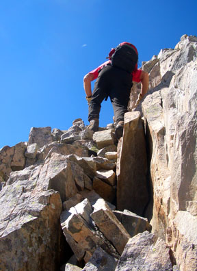 Gerry Roach reaching the southeast ridge of Precarious Peak